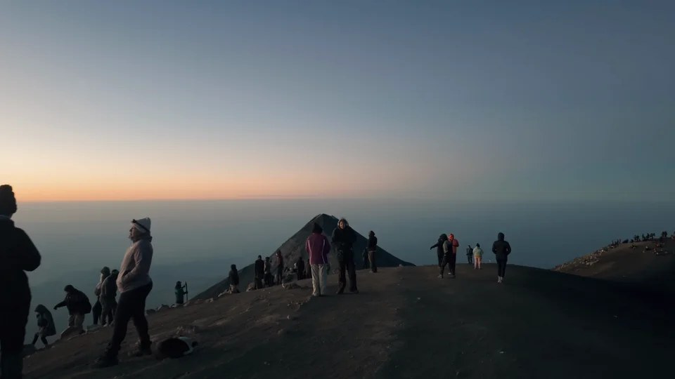 Hikers reaching the summit ridge of Acatenango at sunrise, Guatemala