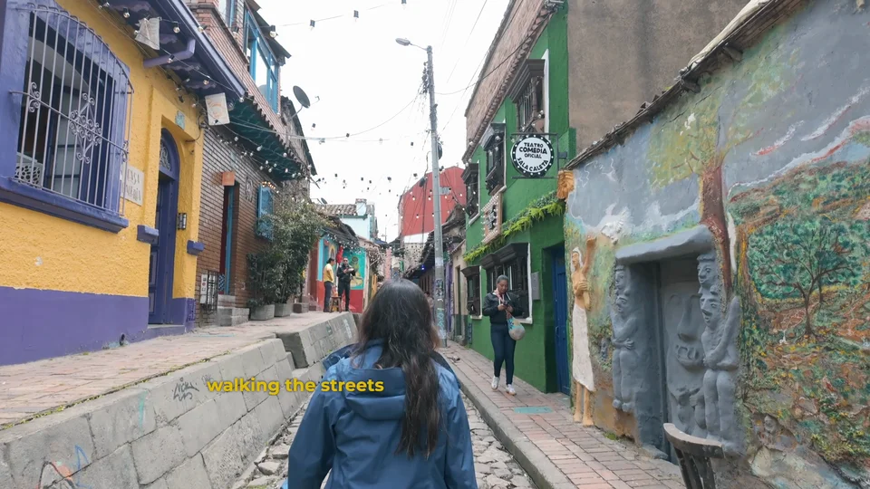Colourful cobbled street in La Candelaria, Bogotá, strung with lights