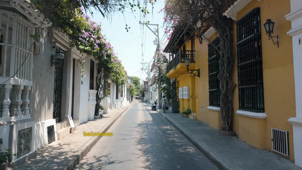 Pastel coloured street with balconies in the old town of Cartagena