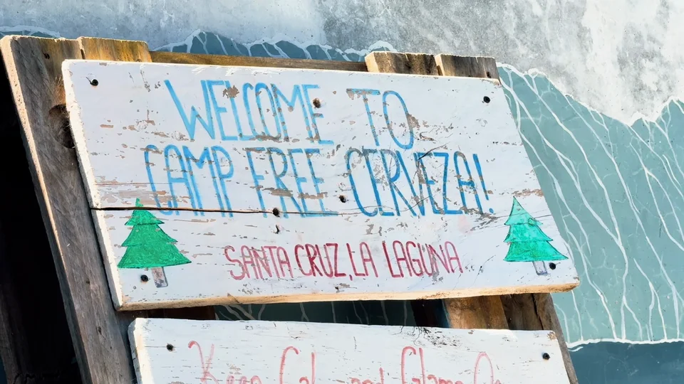 Welcome sign for Free Cerveza hostel in Santa Cruz La Laguna, Lake Atitlán, Guatemala