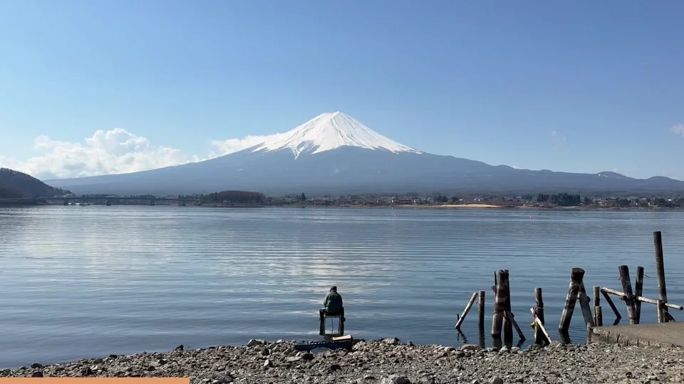 Mount Fuji reflected in the still water of the lake