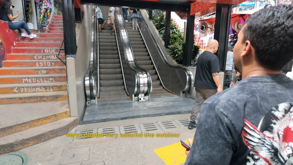 Outdoor escalators running up the hillside through Comuna 13, Medellín