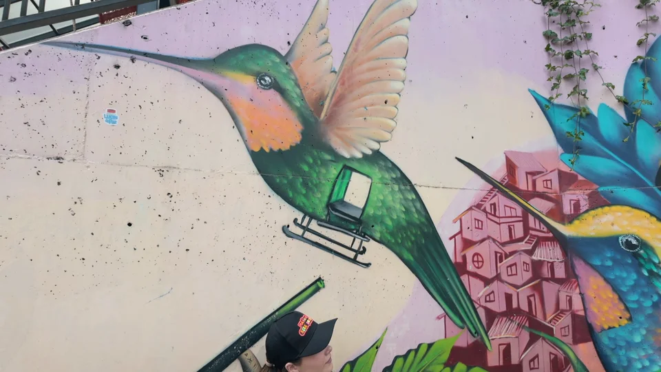Colourful hummingbird street mural in Comuna 13, Medellín, Colombia