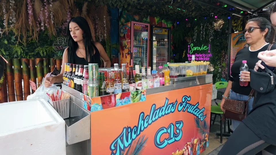Street vendor stand selling micheladas in Comuna 13, Medellín, Colombia