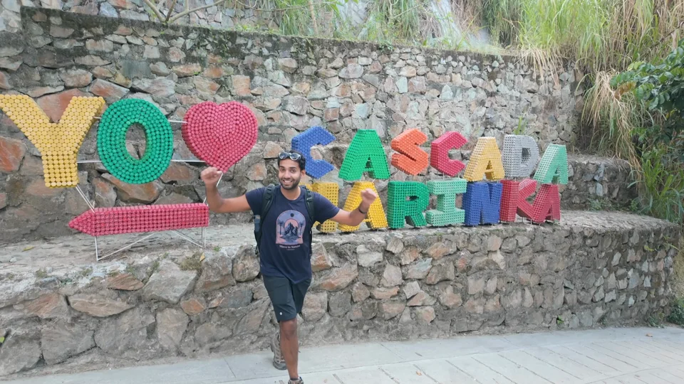 Colourful Cascada Marinka sign on the trail to the waterfall near Minca, Colombia