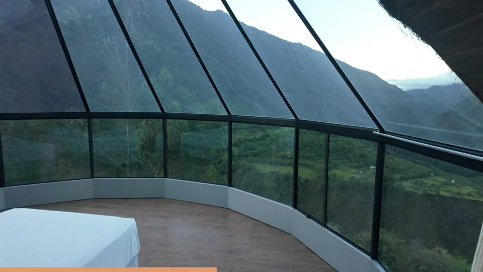 View over the mountains from inside a glass dome on the Salkantay Trek