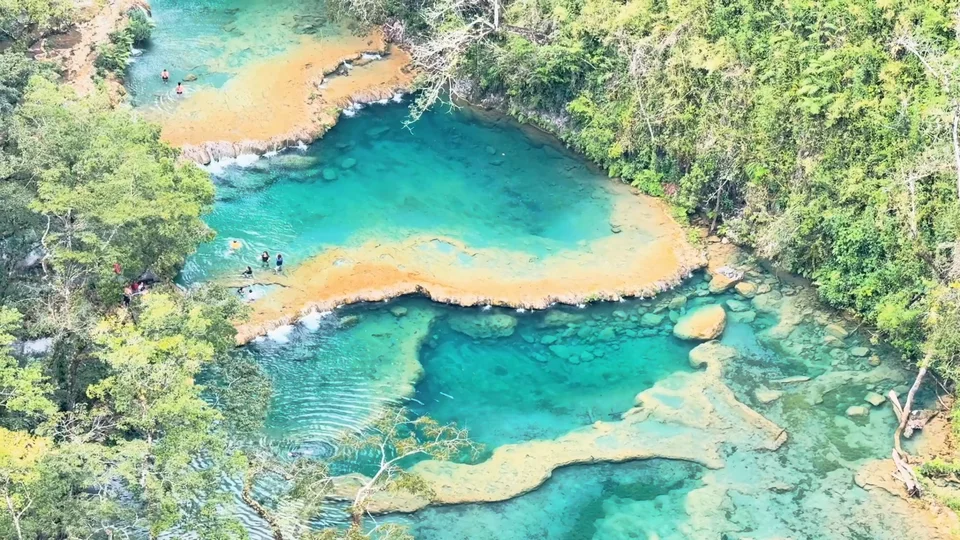 Aerial view of the turquoise stepped pools of Semuc Champey, Guatemala, from El Mirador viewpoint