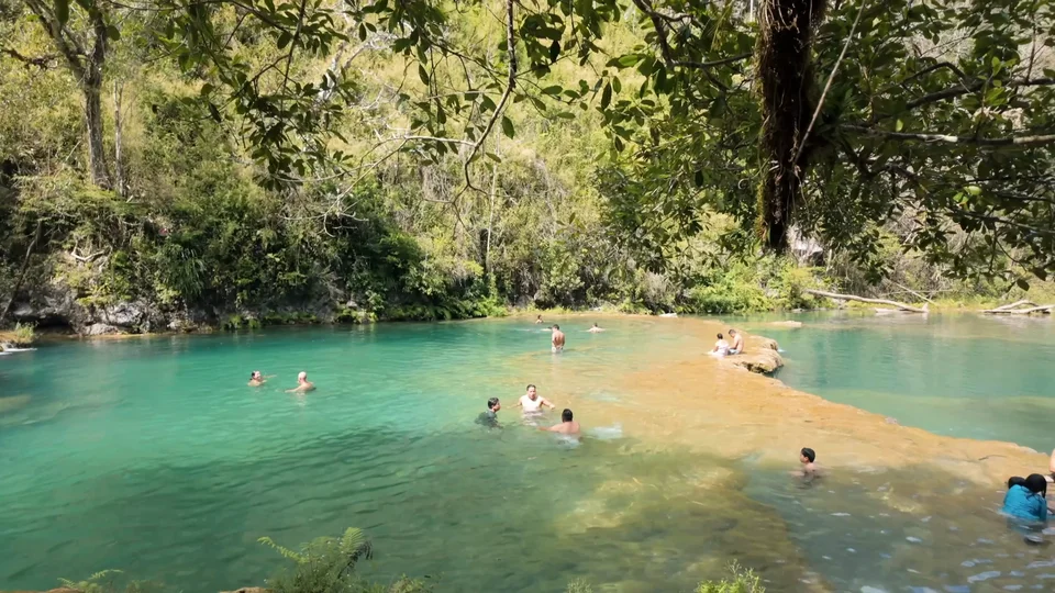 Swimming in the turquoise pools of Semuc Champey, Guatemala
