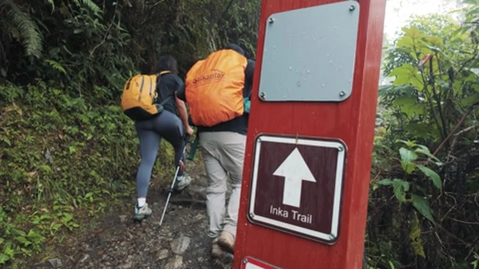 Hikers climbing stone steps on the Inca Trail