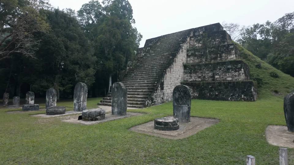 Complex Q, stone stelae and pyramid at Tikal, Guatemala