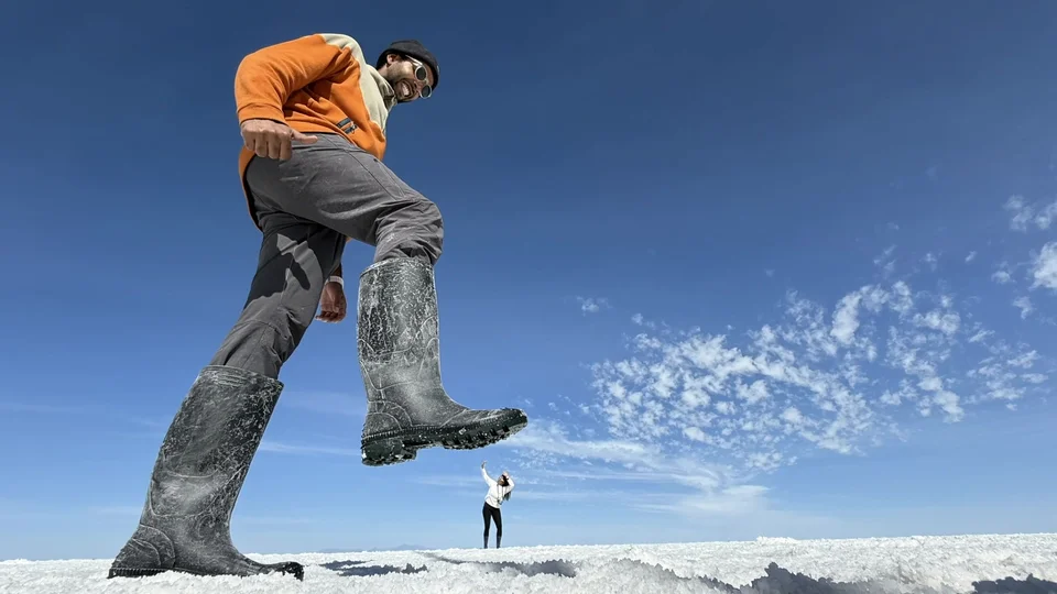 Forced perspective photo of giant boots on the Uyuni Salt Flats