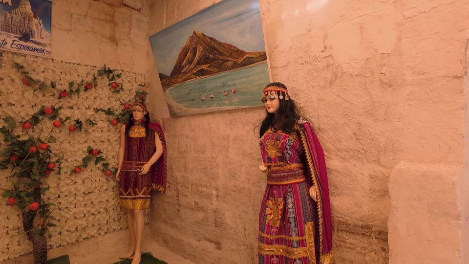 Interior of a salt hotel restaurant on the Uyuni Salt Flats decorated with traditional Andean dress