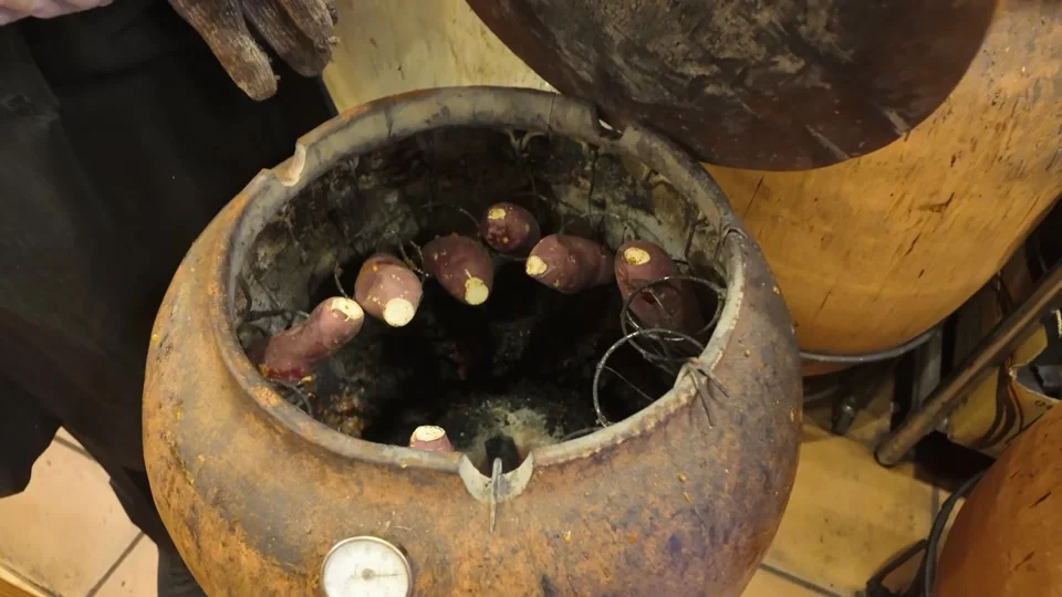 Sweet potatoes roasting in a clay pot on the street, Ginza