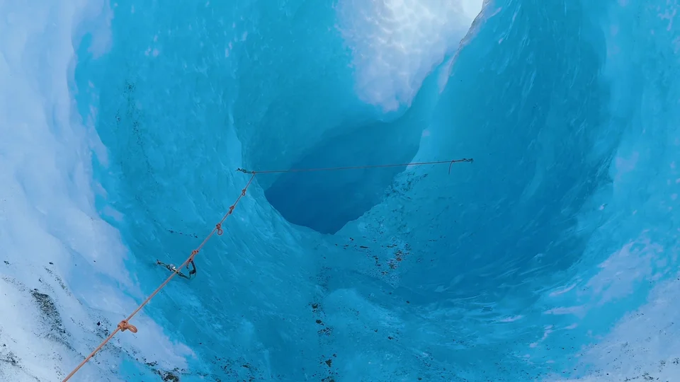 Looking down into a blue ice crevasse on the Grey Glacier, Patagonia
