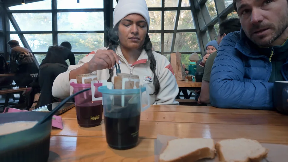 Making coffee and packing sandwiches for breakfast at Camping Frances on the W Trek