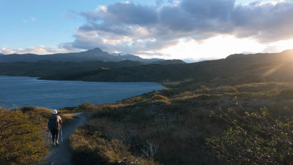 Hiking towards Paine Grande at sunset along the lake, Torres del Paine