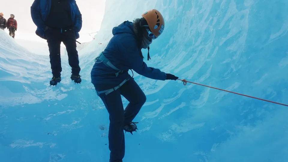 Ice climbing on the Grey Glacier with a rope and crampons, Patagonia